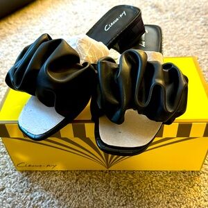 NWTO and box black ruffle sandals size 7.